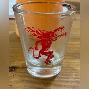 Fireball: whiskey shot red dragon logo on front modern holds about 1.75 ounces.